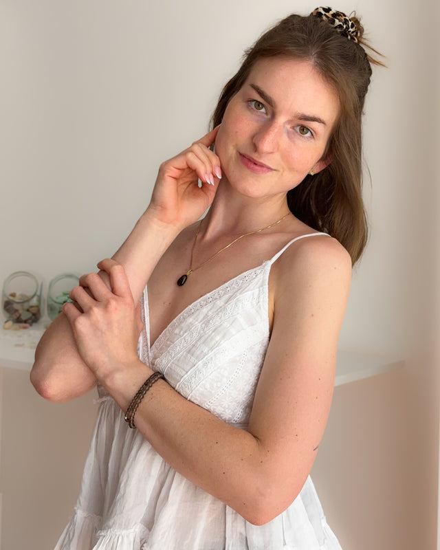 <h2>Perlenarmband aus<br/>Rauchquarz</h2>